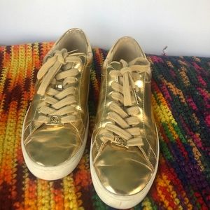 Michael Kor’s gold sneakers